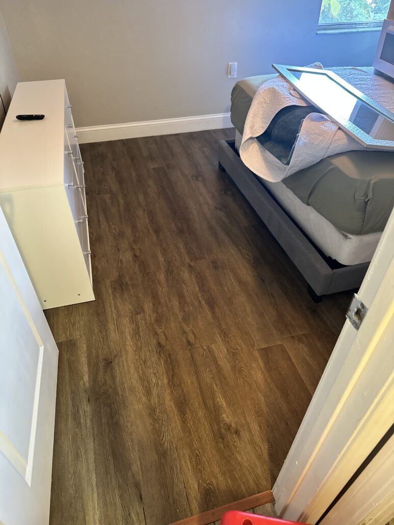 Luxury vinyl plank flooring before cleaning
